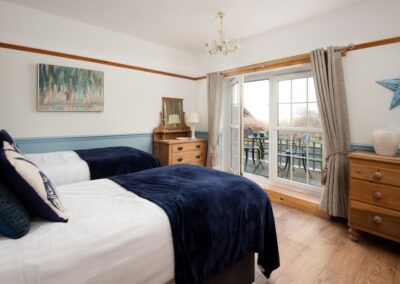 Twin bedded room with balcony
